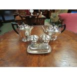 Four pieces of Viner's Sheffield plate including teapot and coffee pot with ebonised handles and