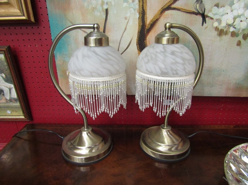 A pair of table lamps with mottled glass shade and beaded fringe