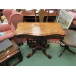 An early Victorian circa 1850 burr walnut serpentine front hinged top card table on a carved and