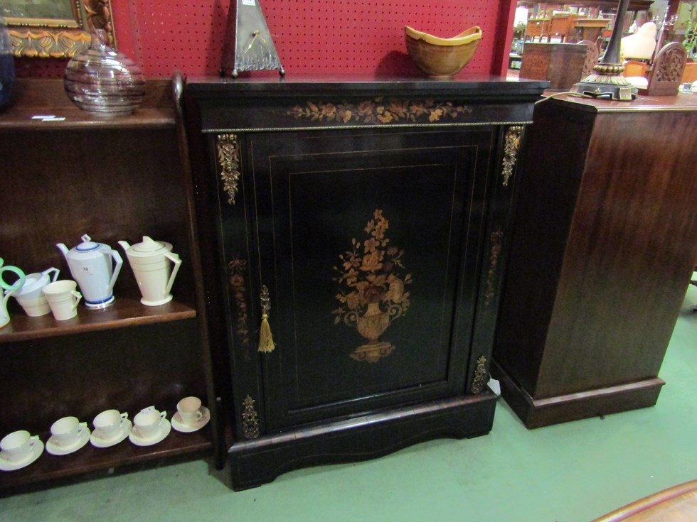 An early 19th Century ebonised and walnut pier cabinet with urn and floral marquetry exotic wood