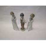 Three Nao Porcelain figures including girl with puppy and boy with football