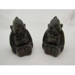 A pair of early 20th Century metal 'Billiken' good luck figures stamped to backs 'US.PDRG Germany