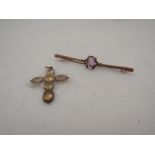 An amthyst set bar brooch stamped 9ct and a stone set cross pendant