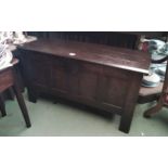 A 17th Century pegged oak coffer the split hinge top over a four panel base on stile feet, 108cm