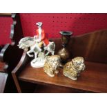 A pair of ceramic Bulldog figures, a dandy on horse back and a laquered Indian candlestick (4)