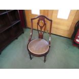 An Edwardian inlaid mahogany bedroom chair with harebell and painted lady decoration over a circular