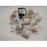 A box of costume jewellery including brooches, bangles, earrings etc