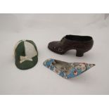 A painted metal love token shoe, the sole inscribed "To G.E. from G. C. 1932" 12cm long, painted