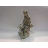 A Lladro figural group of a boy with sheep, 24cm tall