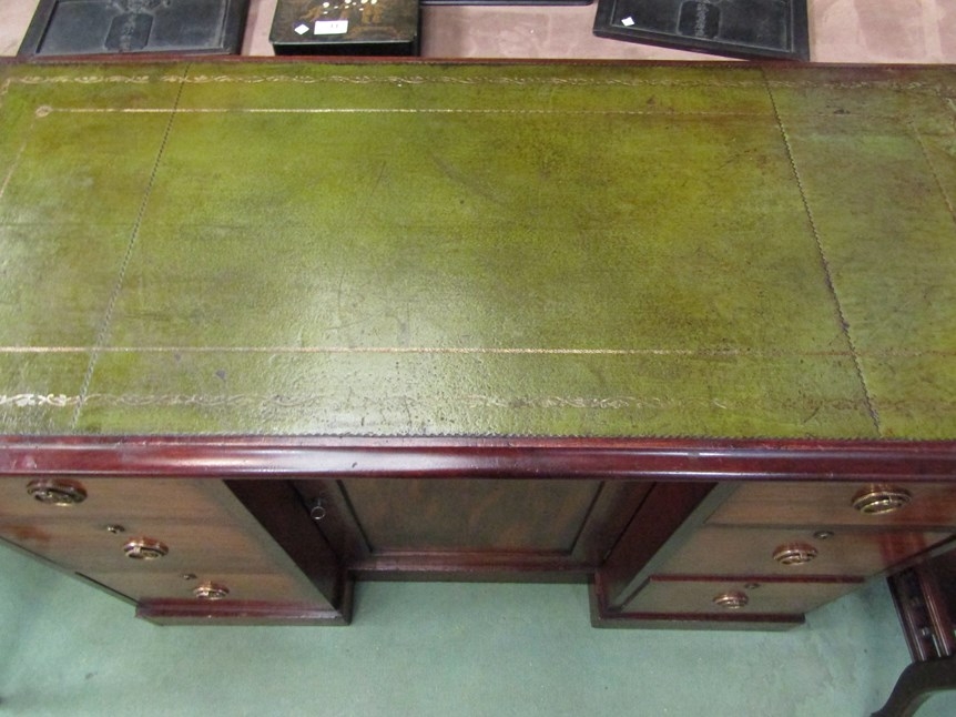 Circa 1860 a mahogany breakfront desk, the gilt tooled leather inset writing surface over six - Image 3 of 3