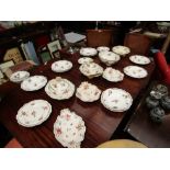 A selection of Victorian white ground table wares with gilt embellishment and floral sprays