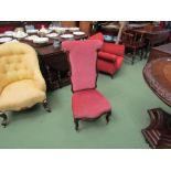 Circa 1840 a walnut bedroom chair having carved frame and fore legs on brass castors