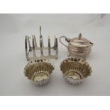 A small quantity of silver items: toast rack, cruets, two salts