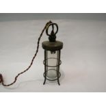 An Arts and Crafts brass lantern with glass domed shade. Collectors electrical item. 31cm high