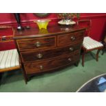 A 19th Century crossbanded flame mahogany bow front chest of two short over two long drawers on