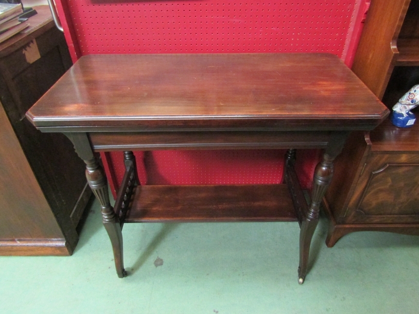 Attributed to Gillows of Lancaster a Victorian walnut card table the canted cover hinged swivel