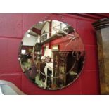 A rouge glass Art Deco circular wall mirror, cut glass decoration of leaves and grapes, 51cm in