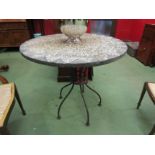 A French style circular top bistro/cafe table the cobbled effect top on a metal base. 76cm tall x