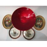 A modern ruby red ceramic bowl and a pair of oval oil paintings of still life and a pair of circular