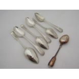 Six silver dessert spoons and a plated teaspoon