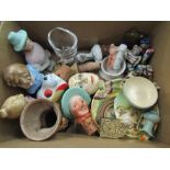 A collection of miniture items: A gully egg cup, bottle stoppers, doll's house items, miniture