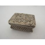 A white metal snuff box, with gilt interior woven form embossed with bull and deer a/f 6cmW x 5cmD x