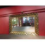 A gilt framed bevel edged wall mirror of oval form and a modern rectangular wall mirror (2)