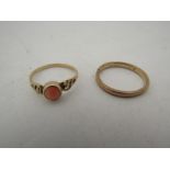 A gold wedding band, marked rubbed, size N, 1.9g and a 9ct gold ring set with coral cabochon, size