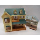 Two unboxed Sylvanian Families playsets to include House On The Hill and Lakeside Pension House