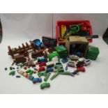 A collection of assorted toy trains and track including Tomy, Thomas the Tank Engine, wooden toys,