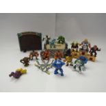 A quantity of playworn Monster In My Pocket figures, ring, podium and board