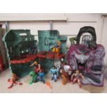 A Mattel He-Man Masters Of The Universe Castle Grayskull playset and Snake Mountain playset together
