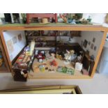 A dolls house box room furnished as a toy shop (40.5cm wide x 25.5cm tall x 28.5cm deep)