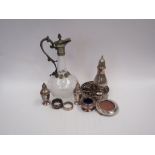 A selection of plated wares including a claret jug with grape and vine etched decoration, wine