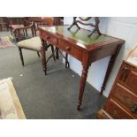 A 19th Century writing table, the tooled leather insert over two frieze drawers on turned and