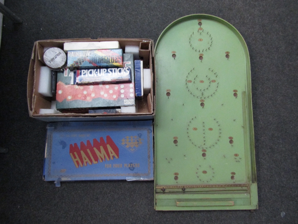 A vintage shove halfpenny board and a quantity of games, etc