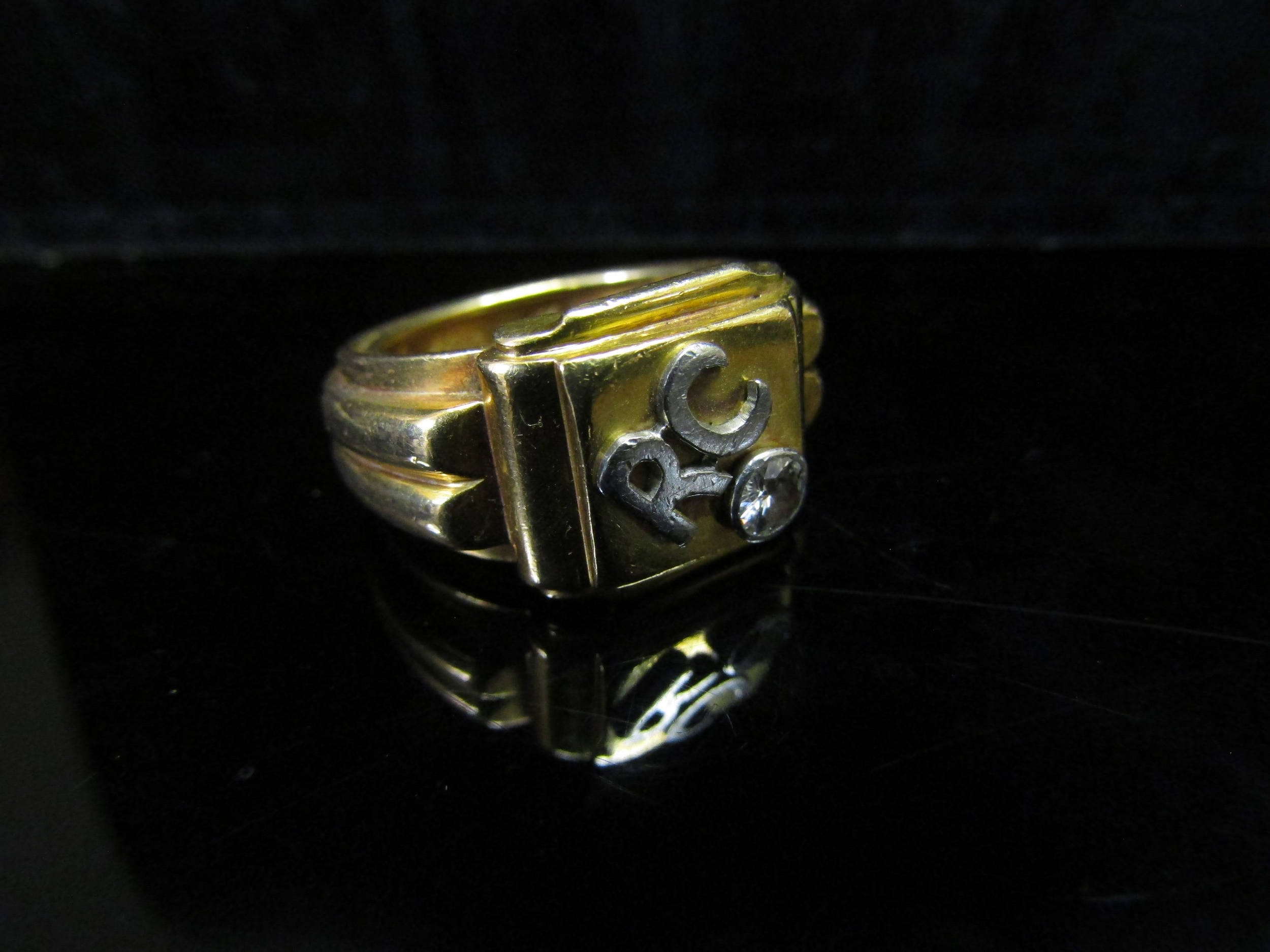 A gold ring unmarked, with raised initials RC and single diamond in rubover setting, 0.20ct - Image 2 of 2