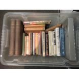 A box of mxied literature, including Margaret Atwood, Annie Proulx, Albert Camus, Armistead Maupin