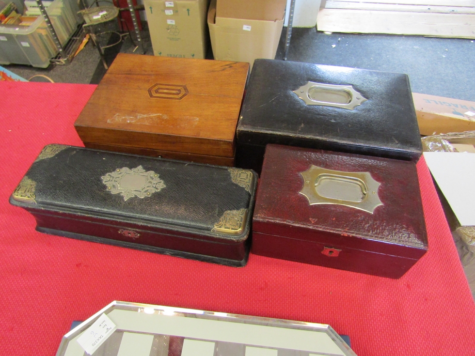 Three Victorian leather bound jewellery boxes one with silk catted interior, one with metal mounts