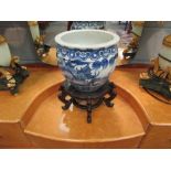 A 19th Century Chinese blue and white jardiniere and stand