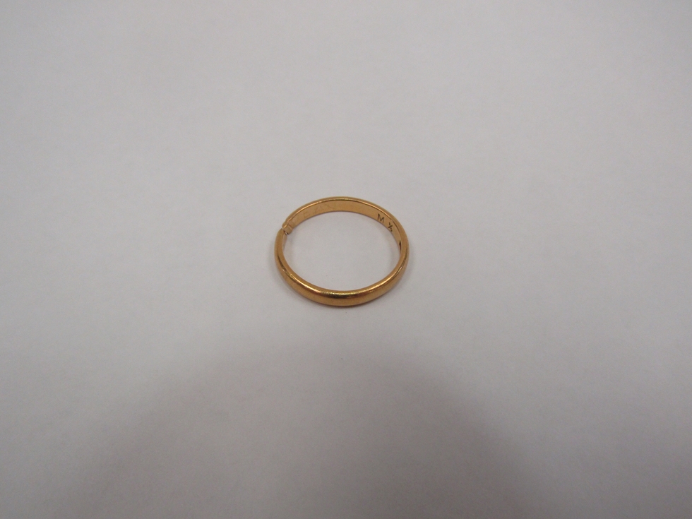 A 22ct gold wedding band, cut, 3 grams