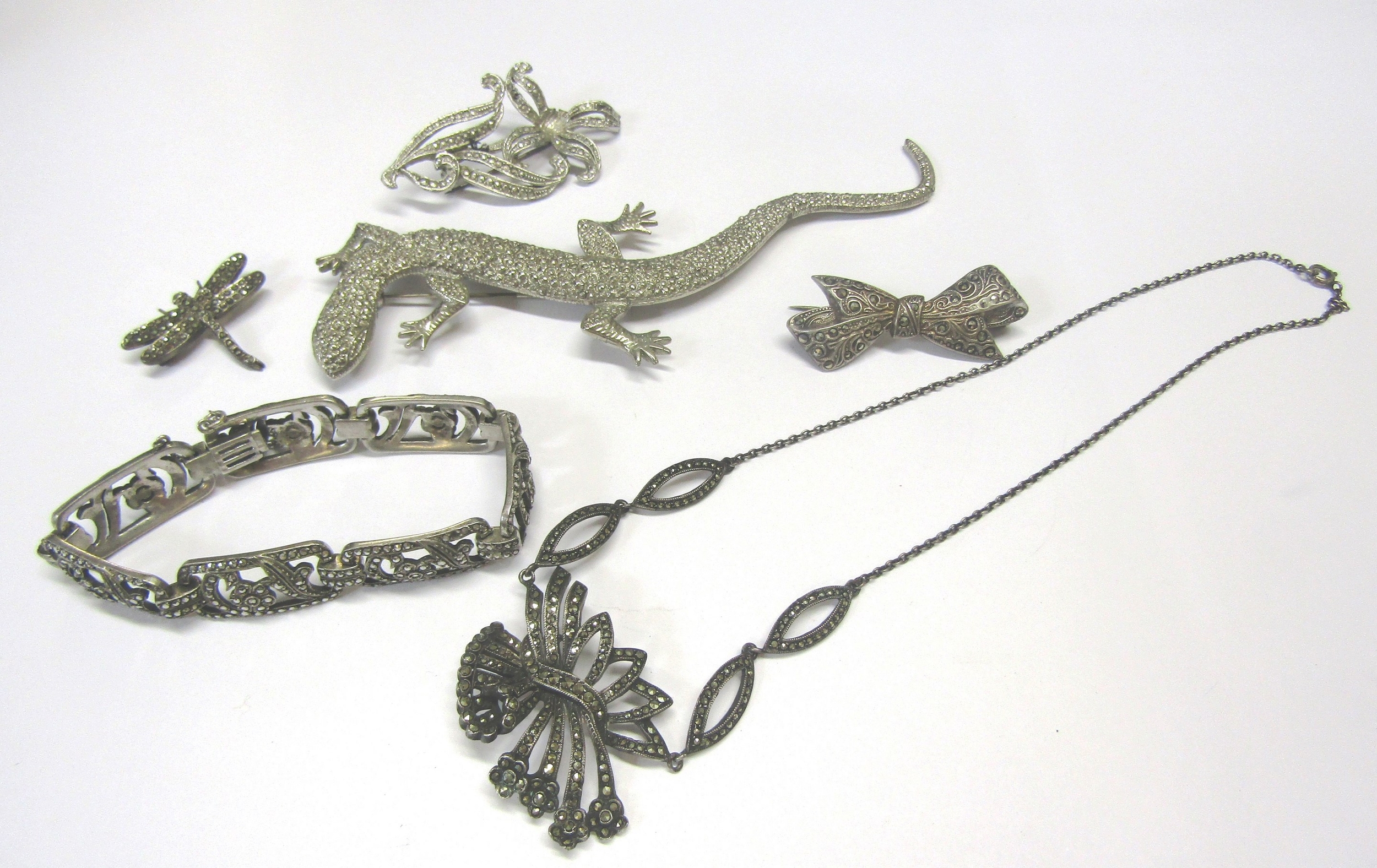 A small quantity of marcasite set jewellery including necklace and bracelet and a lizard brooch