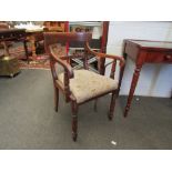 A 19th Century mahogany scroll arm elbow chair with needlepoint seat on melon fluted fore legs