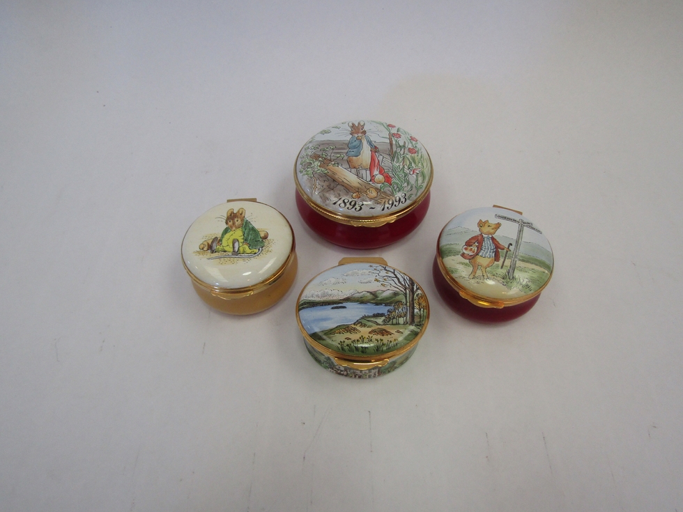 Four enamel pill pots Beatrix Potter themed including a commemorative centenary of Peter Rabbit