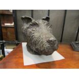 A bronze sculpture of a dog's head, 32cm x 23cm