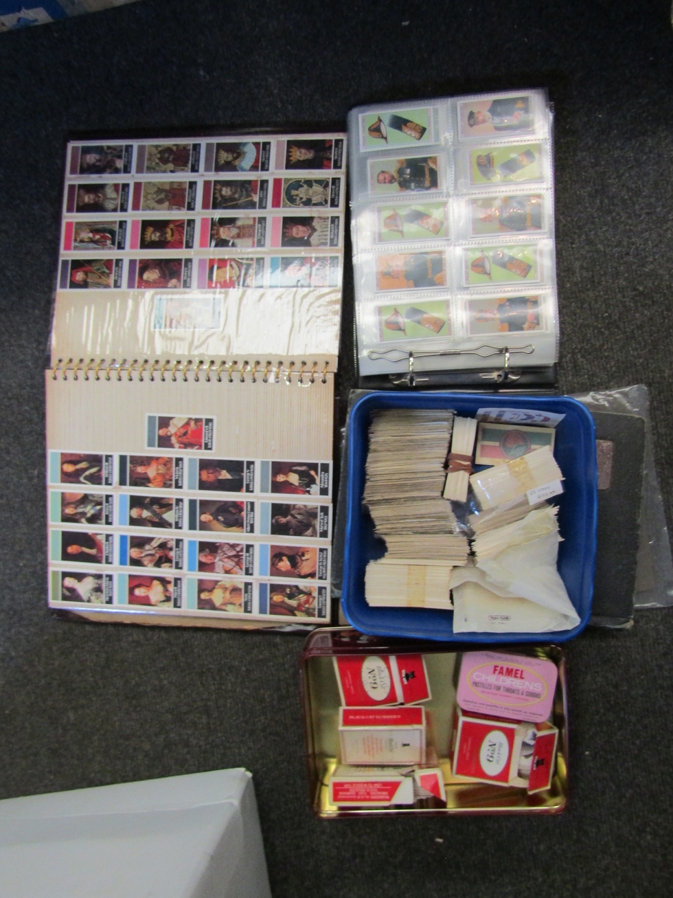 A box of various cigarette cards