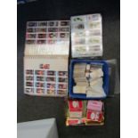 A box of various cigarette cards