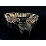 A rolled gold gate bracelet with padlock clasp