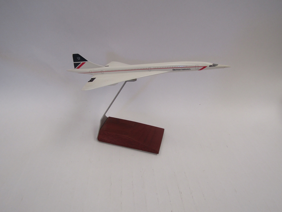 A Concorde model on stand, 20cm tall including stand