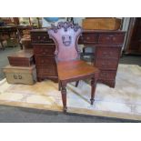 A Victorian mahogany hall chair, with cartouche-shape back, seat split